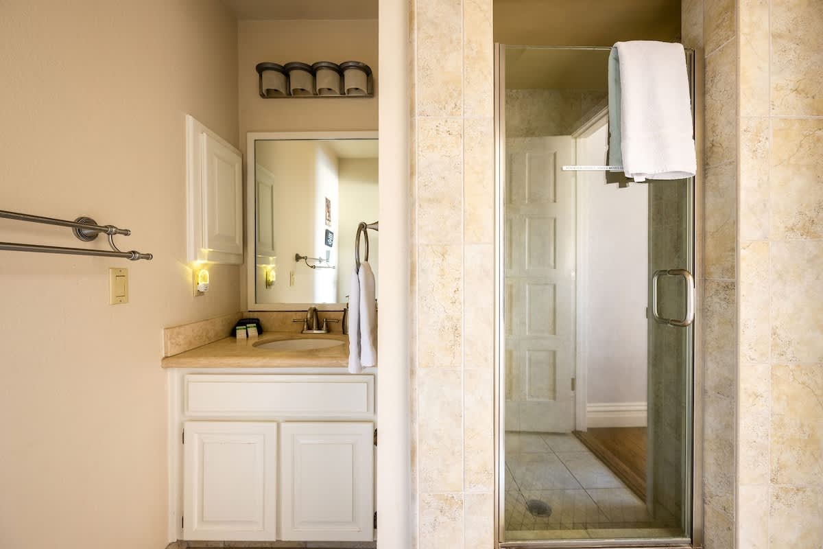 Convenient en-suite bathroom with shower, offering comfort and privacy for guests staying in the Highbury & Islington Bedroom.