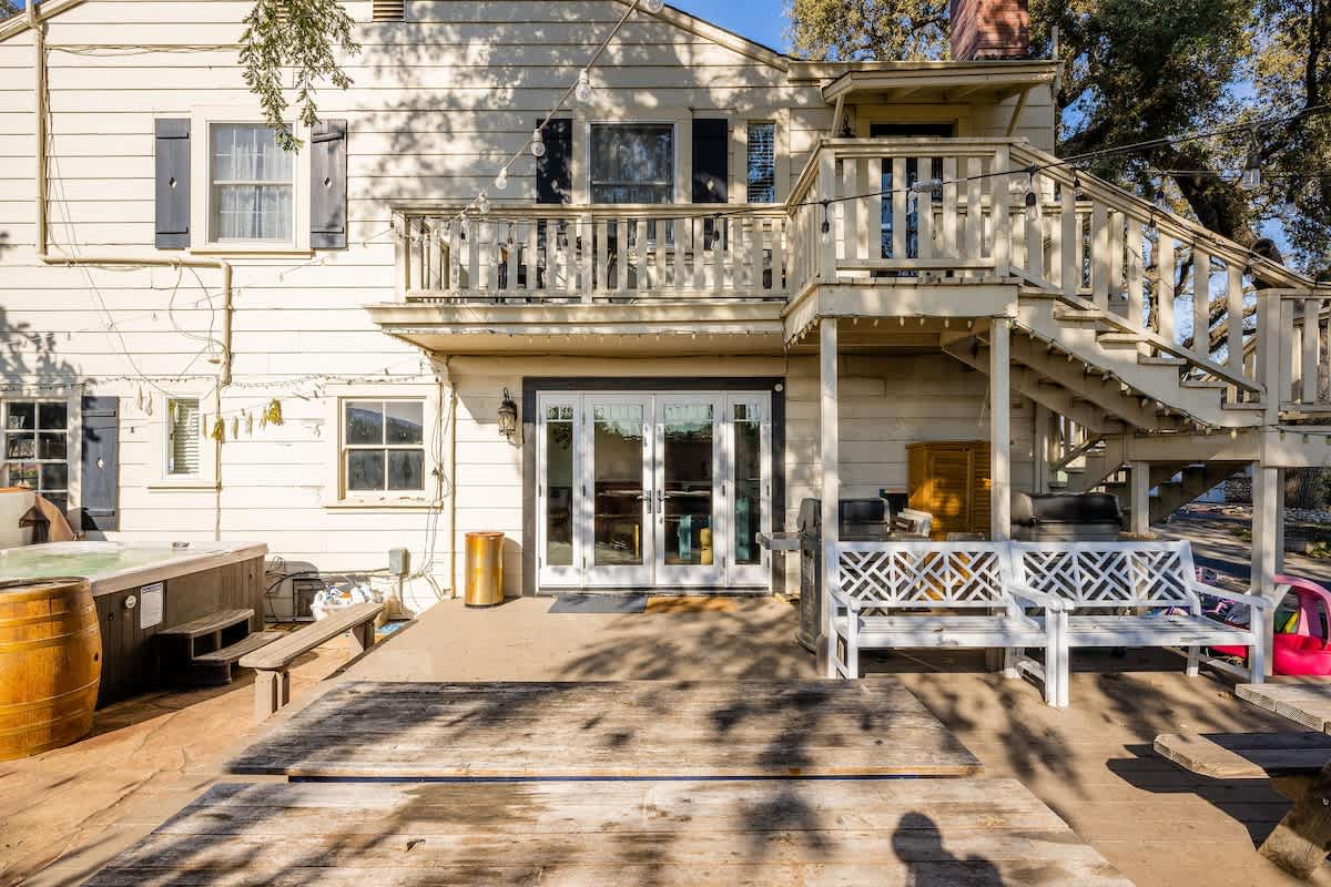 Spacious patio with string lights and flexible seating—ideal for team dinners, breakout sessions, or relaxed networking during your San Martin retreat.