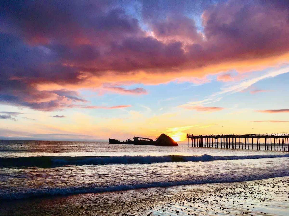 Stroll to the historic SS Palo Alto ‘Cement Ship’ and Aptos Pier—an iconic spot for sunset walks, family photos, and local history by Monterey Bay
