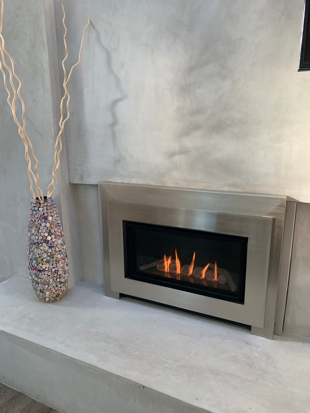 Unwind by the modern fireplace—perfect for cozy family nights, a romantic evening, or relaxing after a long workday.