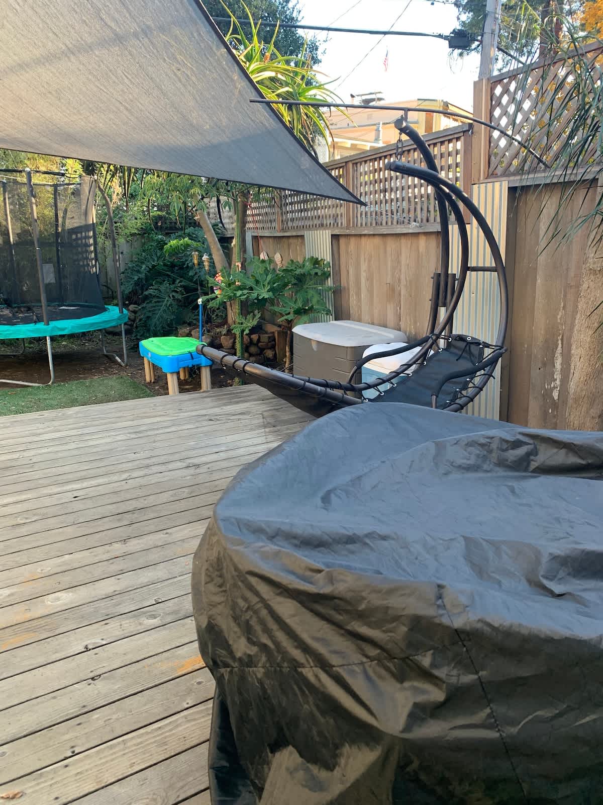 Spacious deck with hammock and play area—perfect for couples to unwind, families to let kids play, or business travelers to relax outdoors after a busy day.
