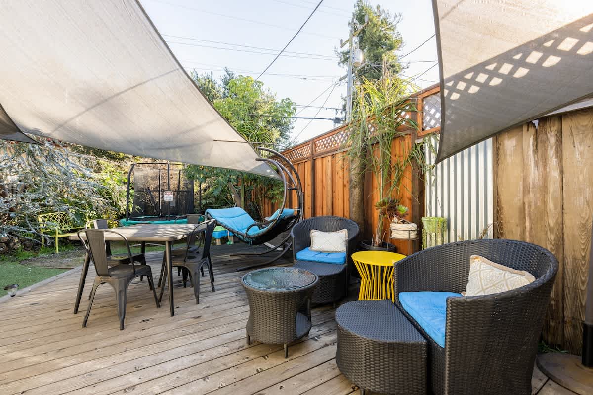 Spacious patio with shaded dining and comfy seating — perfect for couples’ date nights, family meals outdoors, or business travelers unwinding after the day.