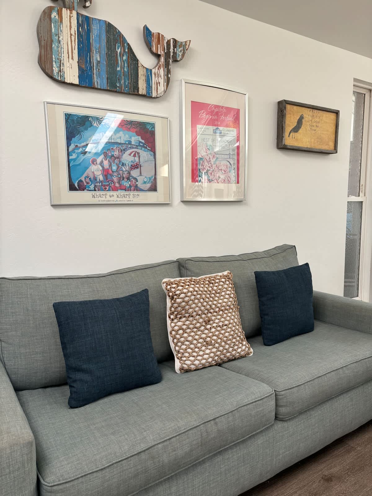 Coastal-chic living room with nautical décor and a comfy sleeper sofa — ideal for families needing extra space, couples enjoying a beachy retreat, or business travelers relaxing in style.