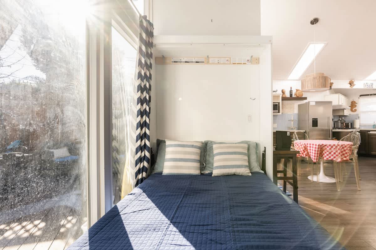 Bright living room with a cozy Murphy bed—perfect for extra guests or kids. Enjoy natural light and easy access to the beach, Santa Cruz attractions, and local dining.