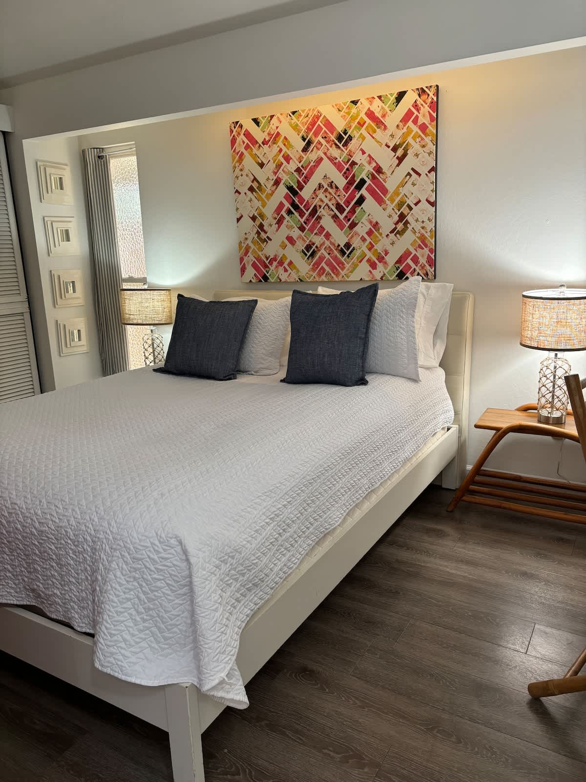 Rest easy in this cozy bedroom featuring a plush queen bed, crisp linens, and soft lighting—your perfect retreat after a day of beach walks, wine tasting, or exploring Monterey Bay.
