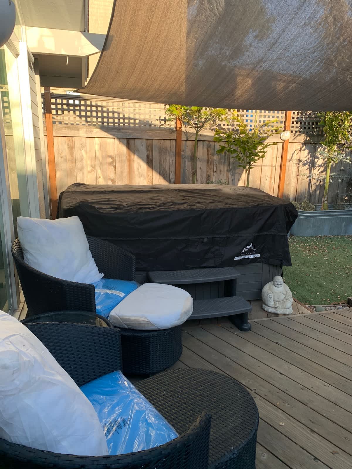 Relax on the private patio with comfy seating beside your hot tub—perfect for morning coffee, family chats, or unwinding after a long workday.