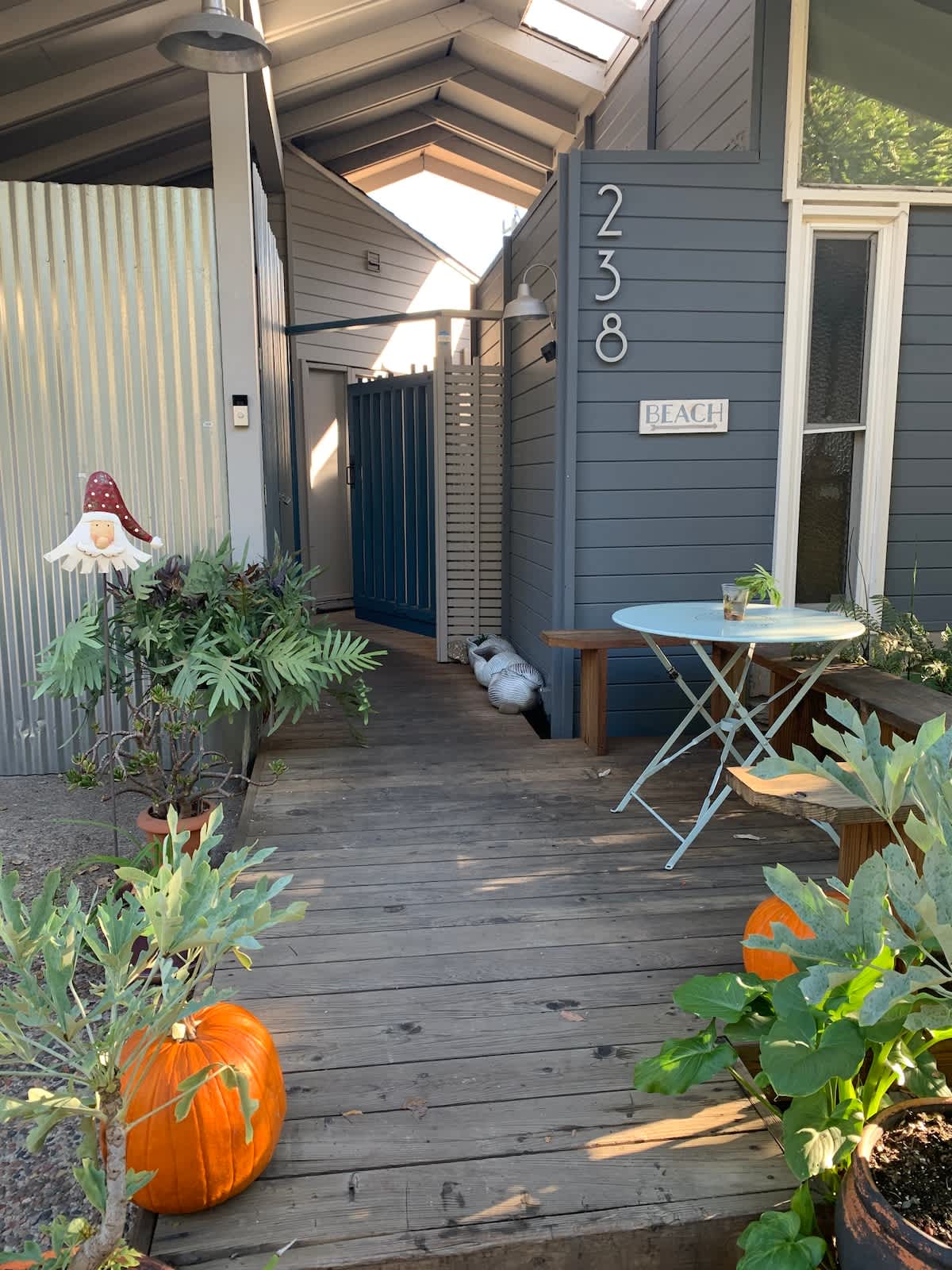 Exterior Entrance – Your Coastal Welcome
Step into your Aptos retreat through this charming private entrance. With its beachy touches, cozy outdoor seating, and vibrant greenery, you’ll feel the coastal vibe the moment you arrive.