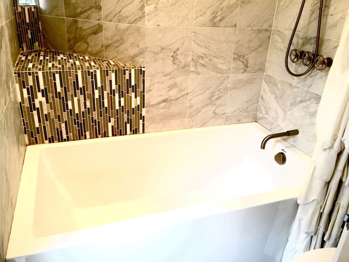 Bathroom with spacious soaker tub! New Enclosed private shower door. 