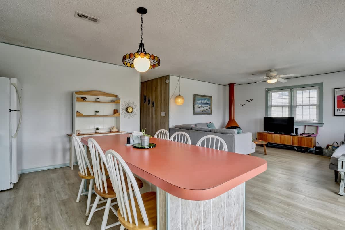 The table easily holds eight with stools on the ends. 