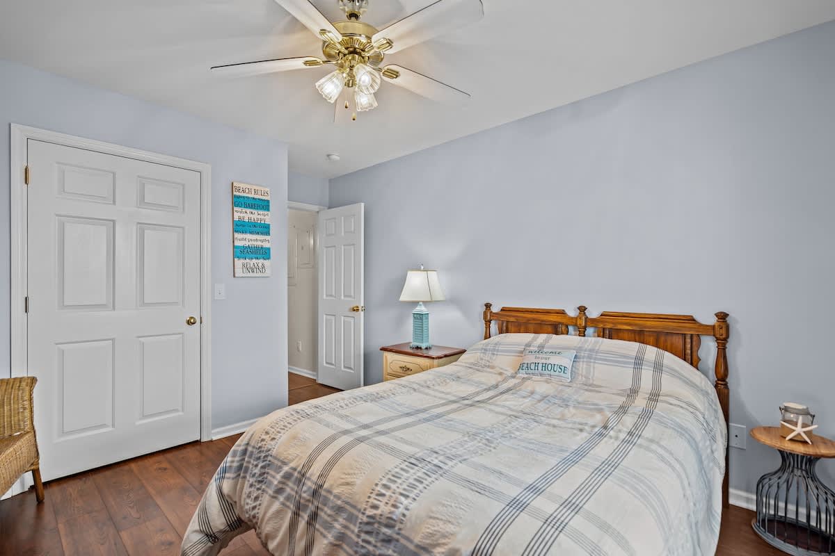 Coastal Comfort Retreat
Unwind in this bright and inviting guest bedroom designed for rest after a full day at the beach. The room features a comfortable queen bed with plush linens a ceiling fan and smart TV add comfort and convenience.