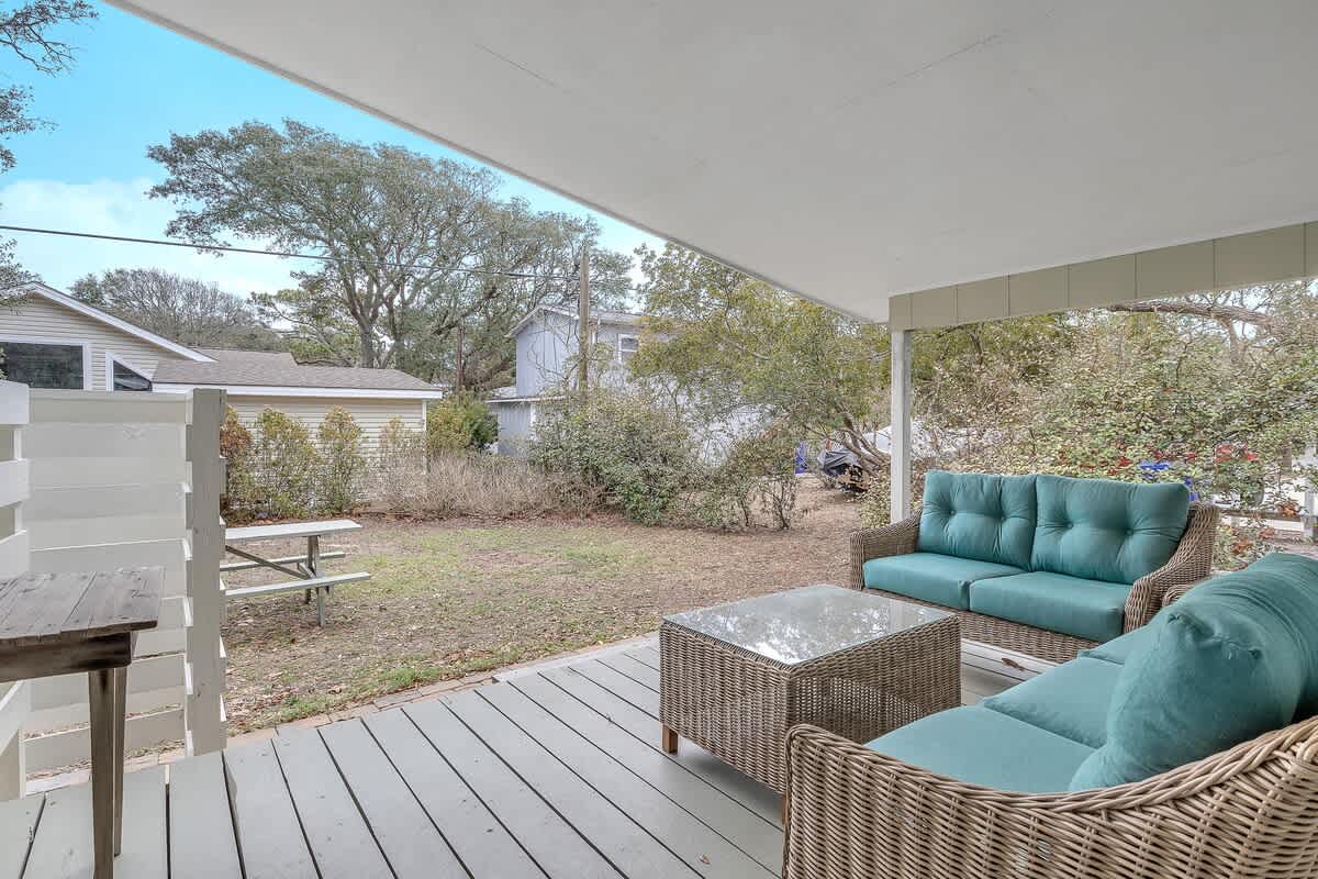 private back yard and large picnic table is great for outdoor meals or playing yard games