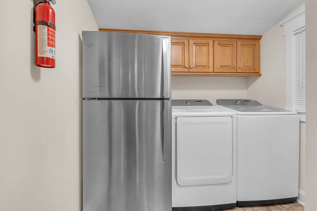 Laundry room has full-size washer and dryer and 2nd full-size fridge to store extra food and beverages