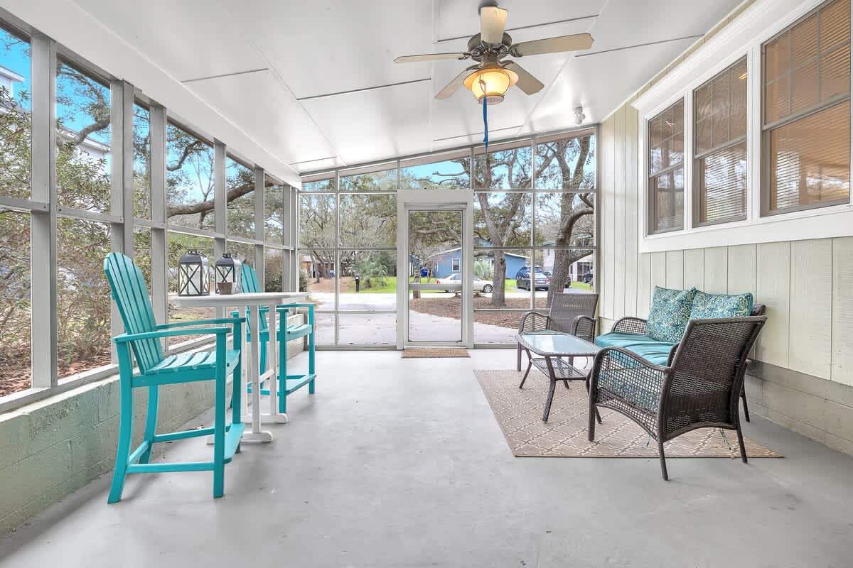 Screened porch can accommodate outdoor dining, yoga, and general relaxation while listening to the soothing ocean waves