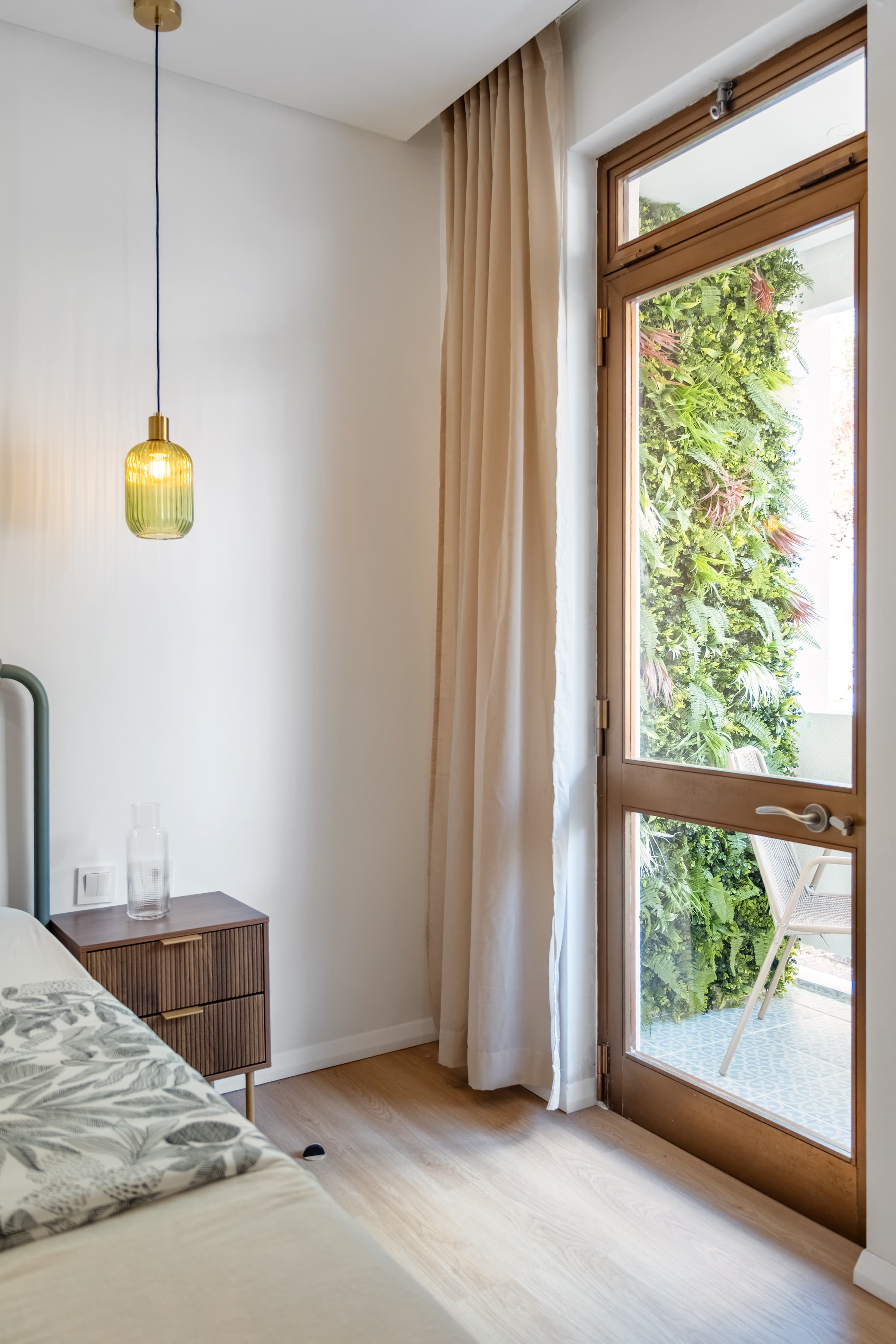 Bathroom with walk-in shower and round backlit mirror