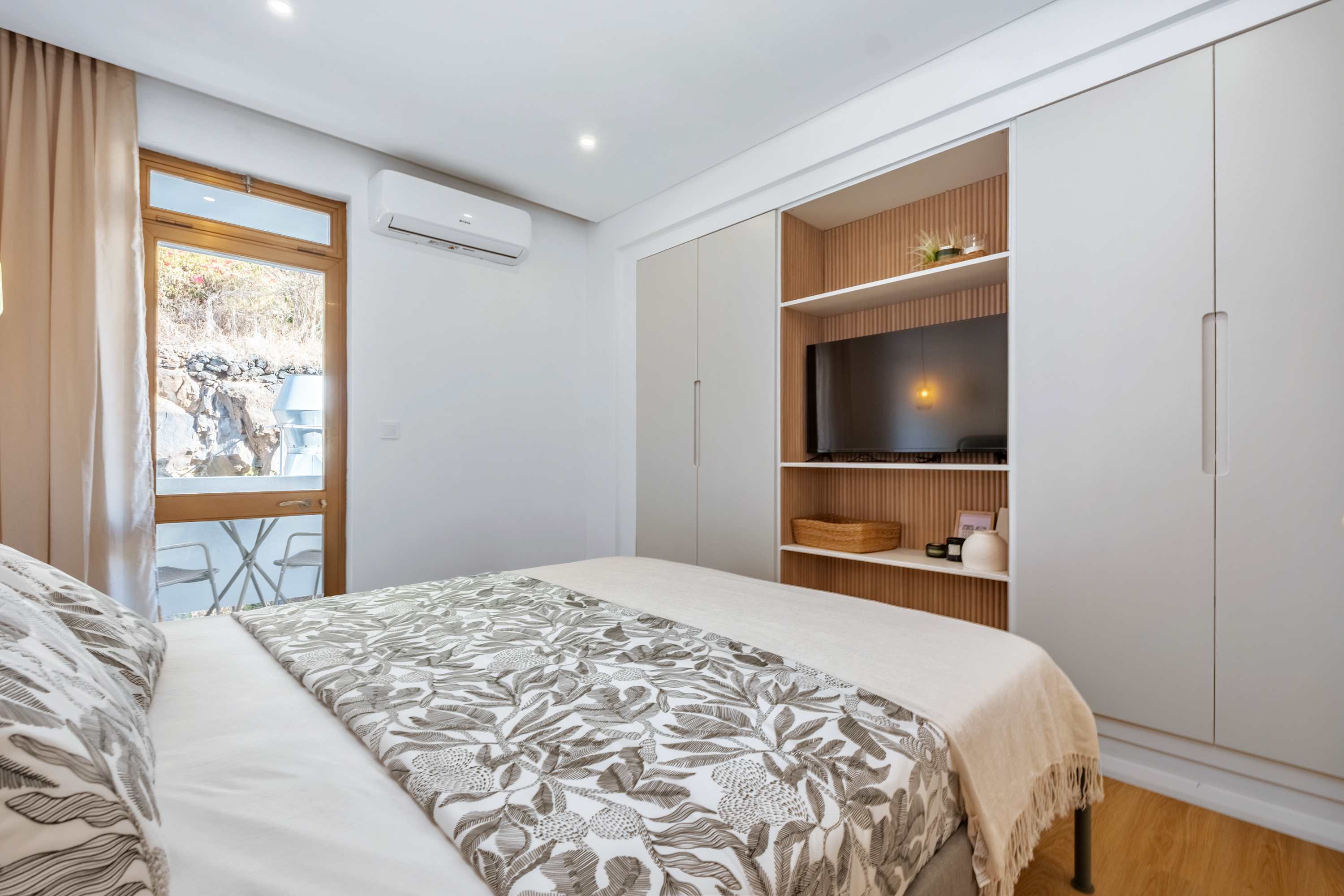 Bedroom with fitted wardrobe and television niche