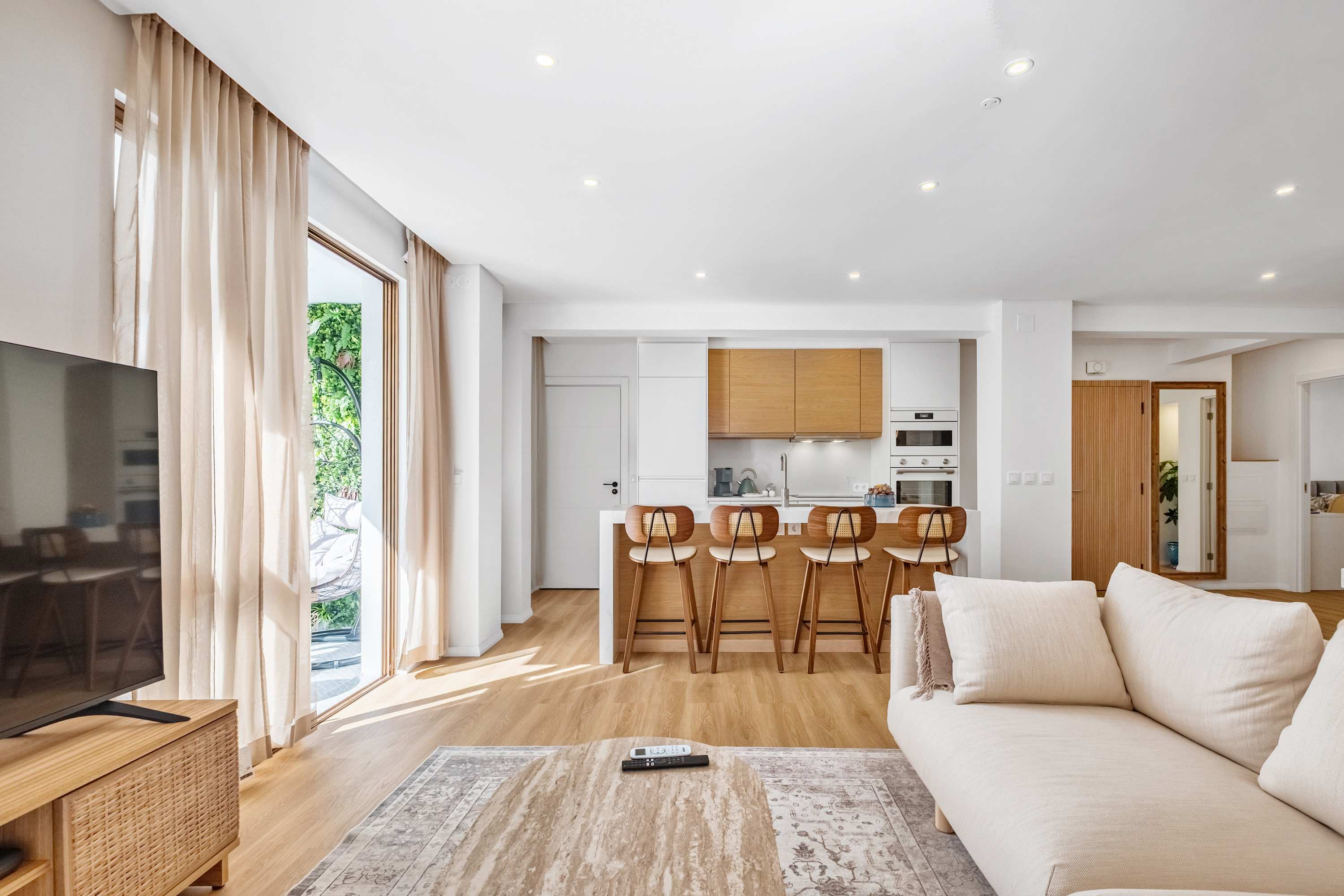 Open-plan living room and kitchen at Palace Vista in Funchal