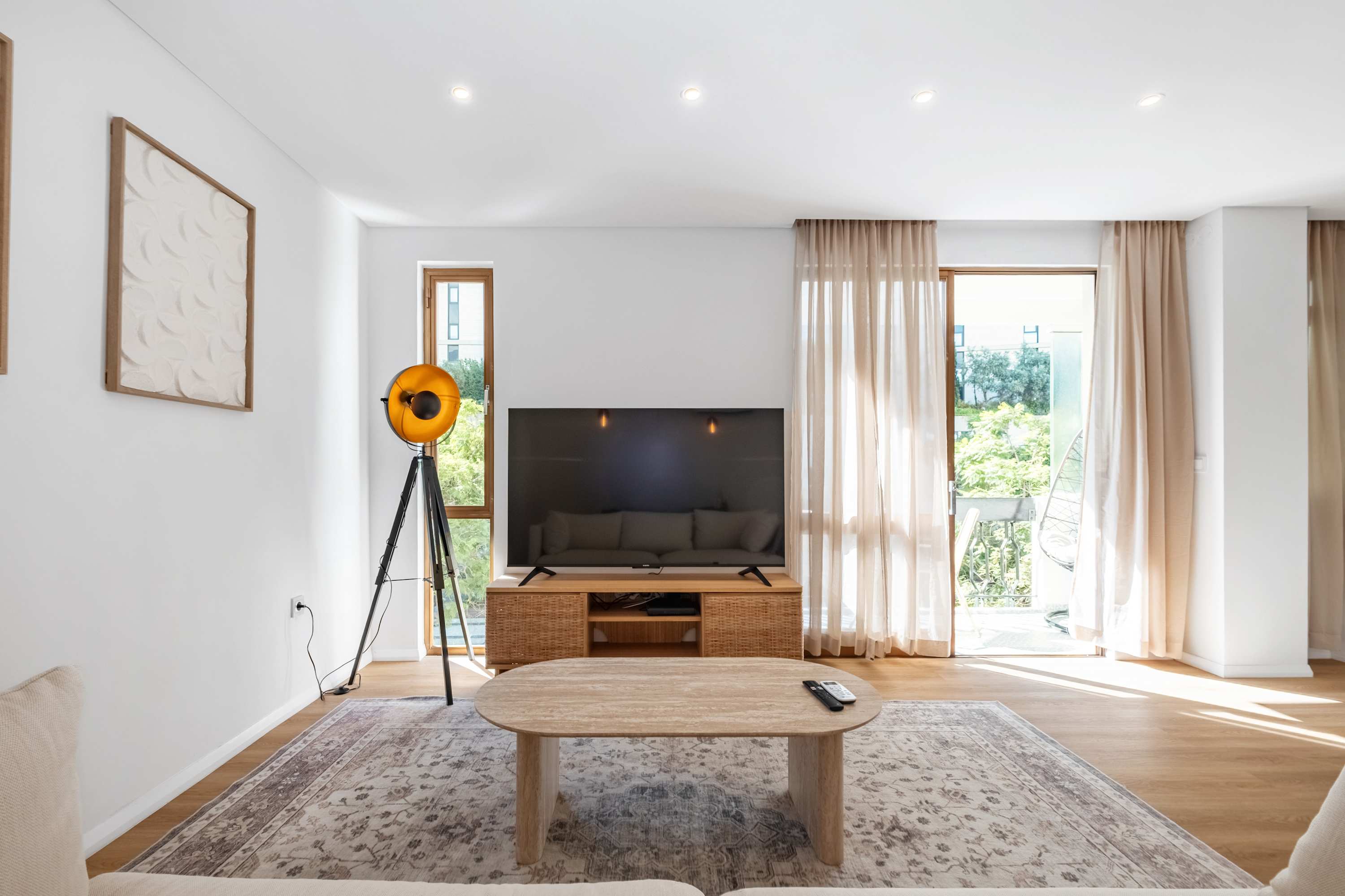 Sitting area with coffee table and balcony curtains