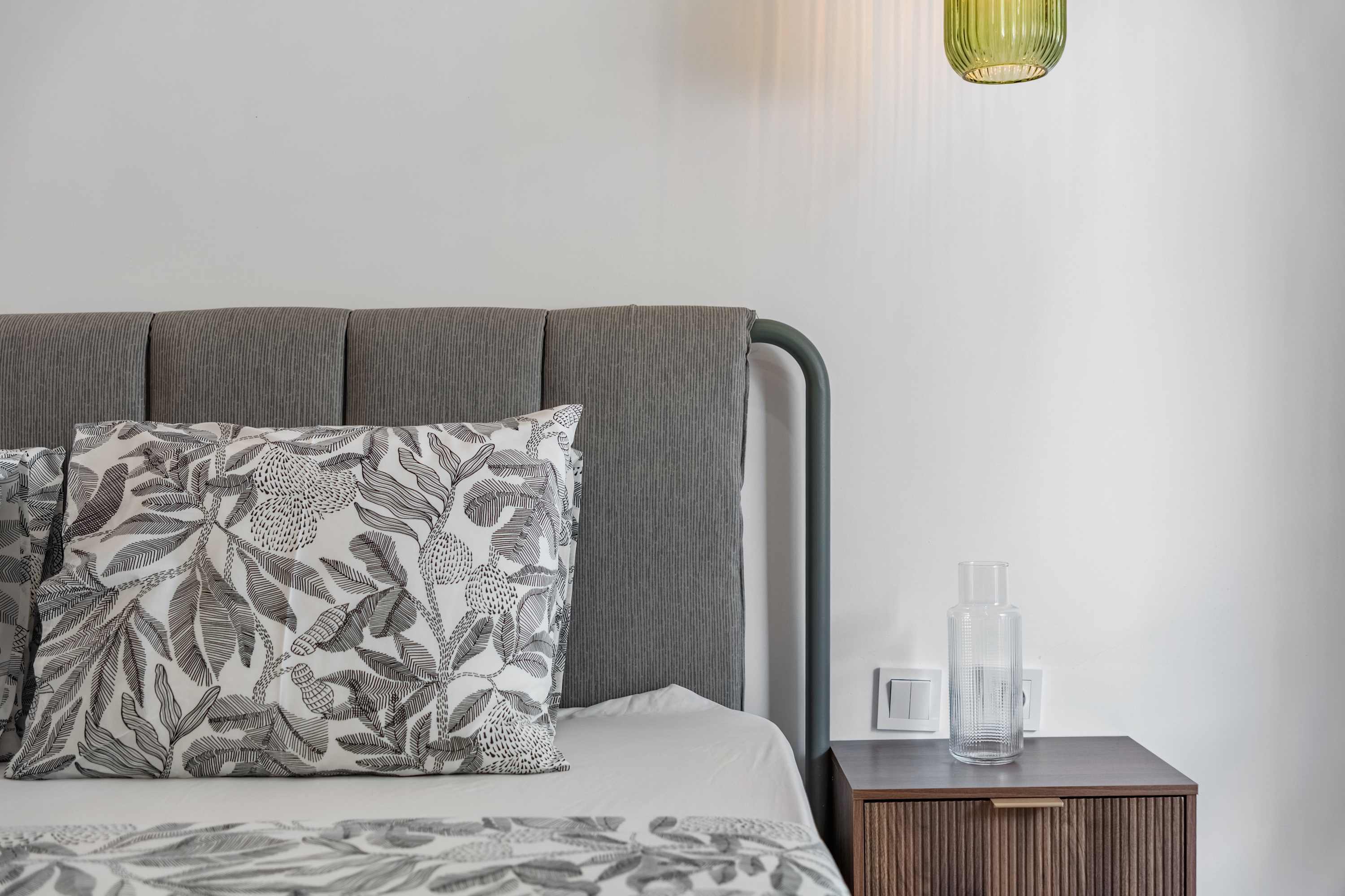 Double bedroom with pendant lights and garden window