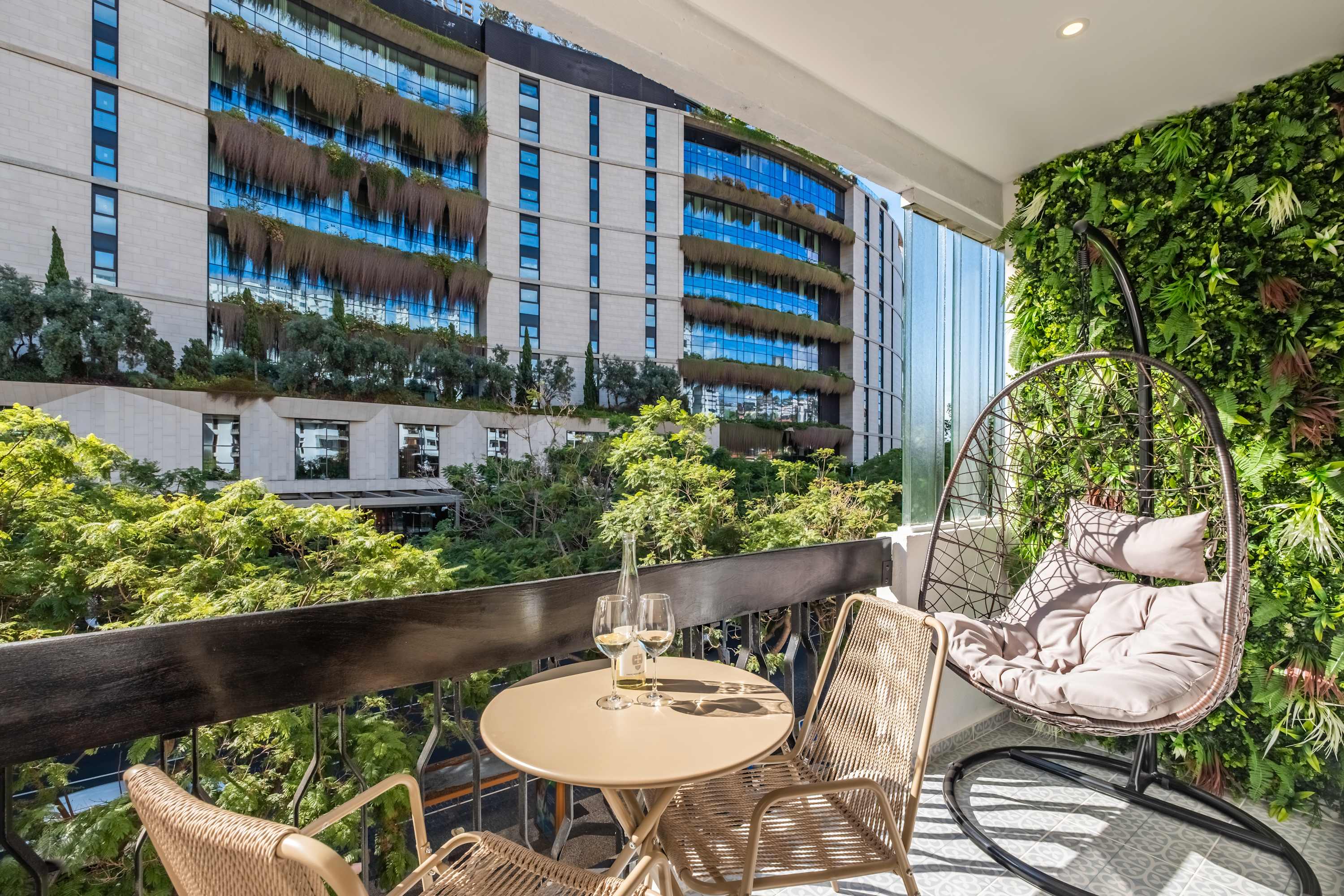 Balcony seating with hanging egg chair at Palace Vista