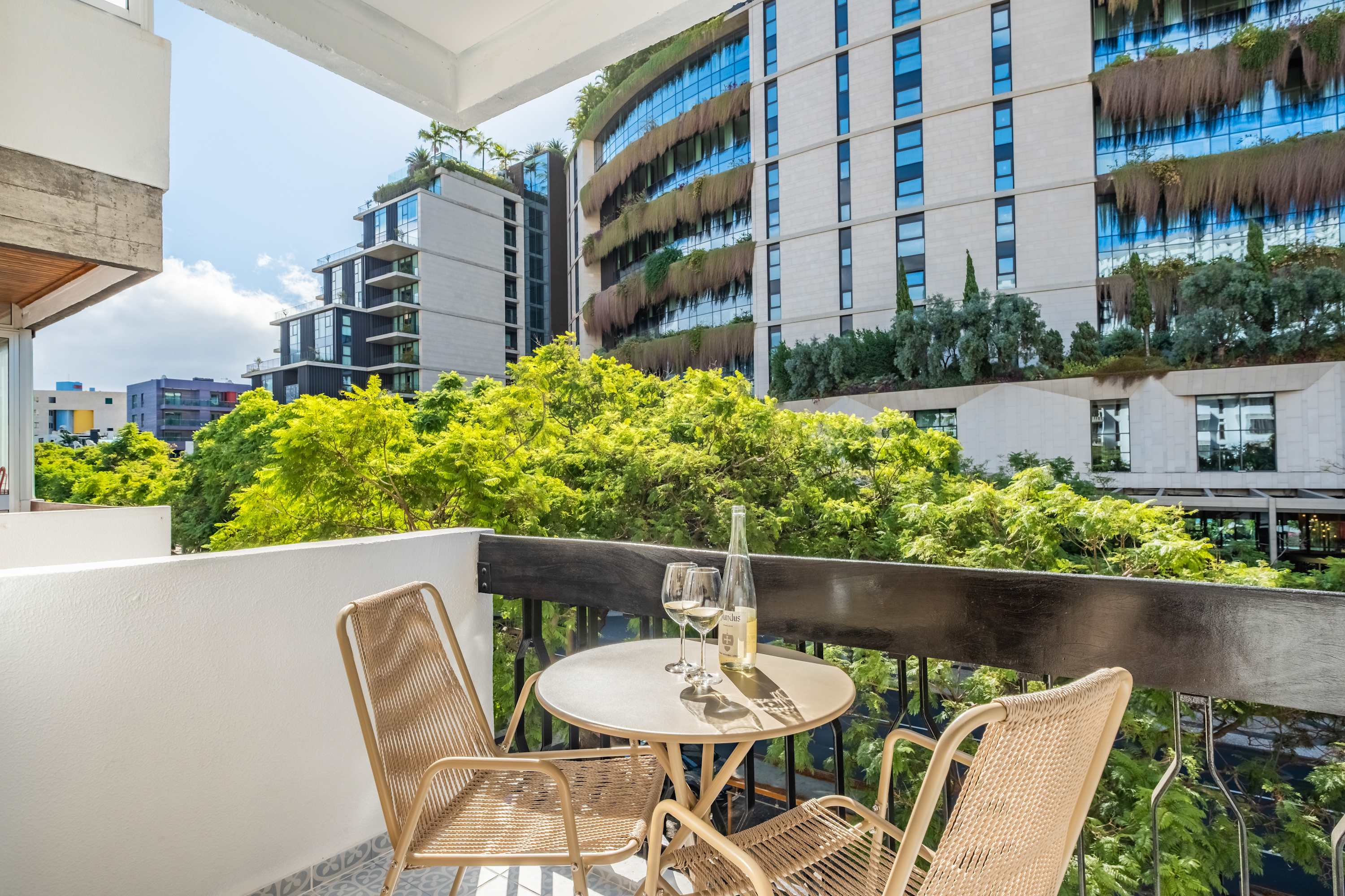 Balcony table set for two above Avenida do Infante