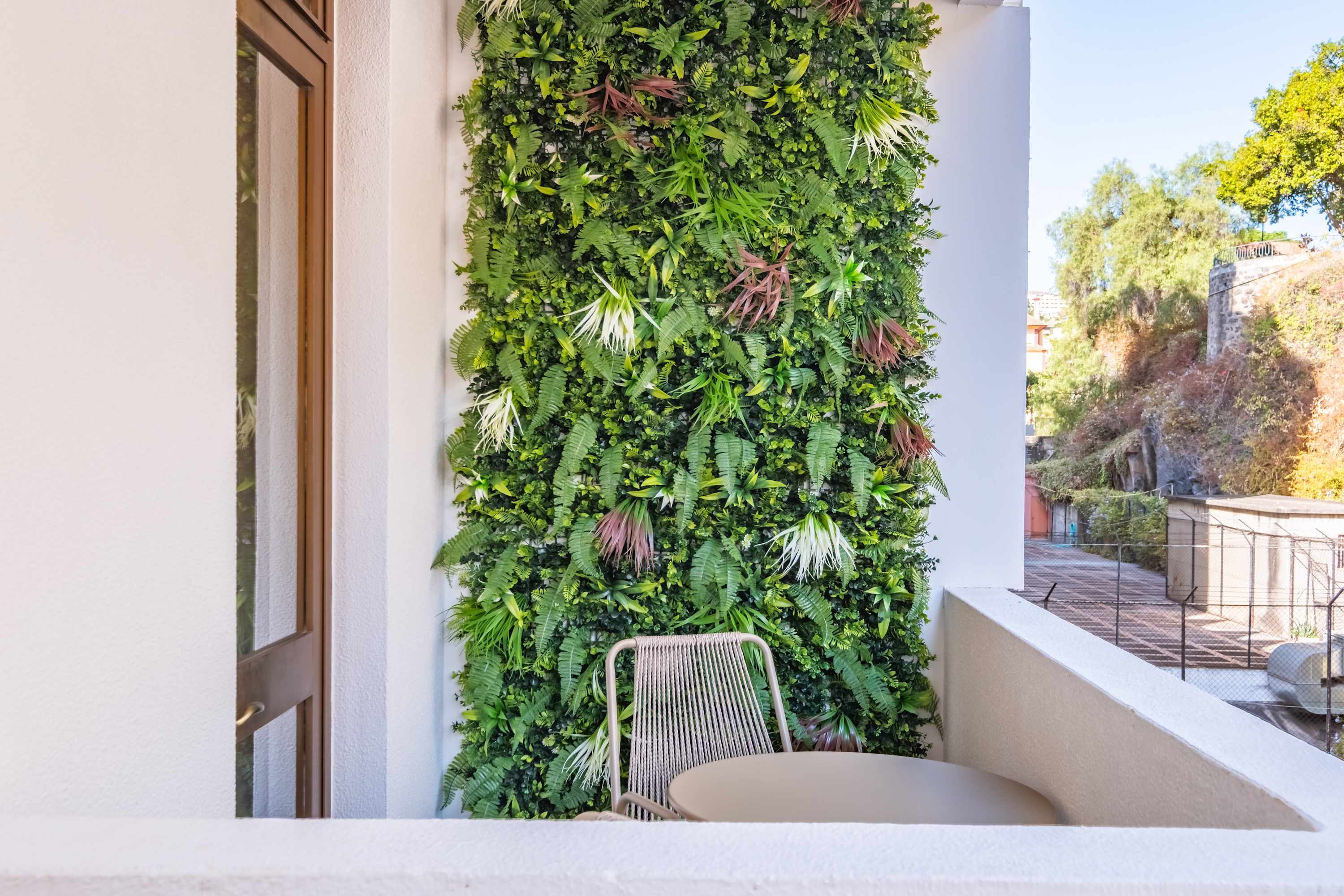 Terrace with a vertical garden wall at Palace Vista