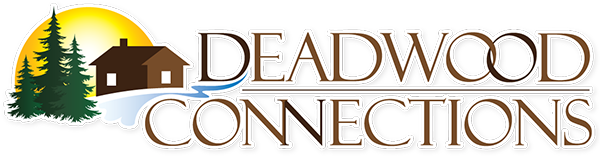 The Deadwood Connections logo featuring three pine trees in front of a cabin, with the sun in the background