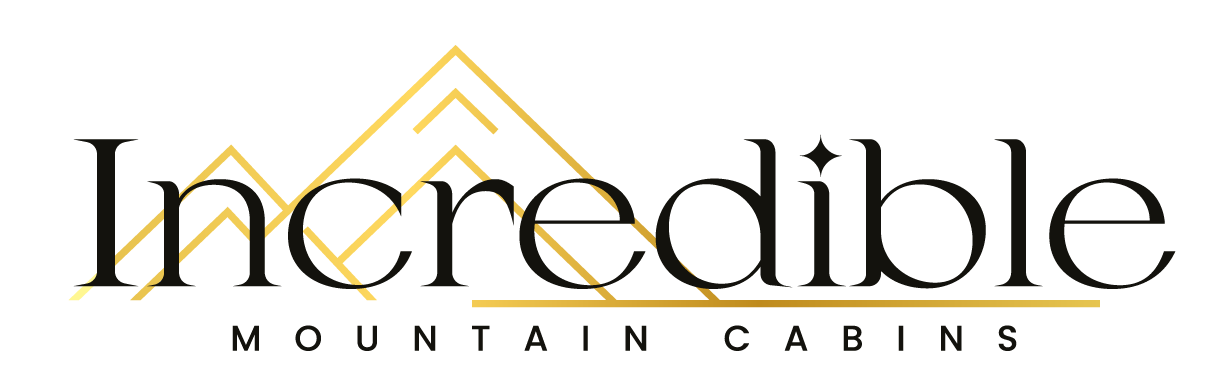 Logo for "Incredible Mountain Cabins," with a mountain graphic and text in black and gold.