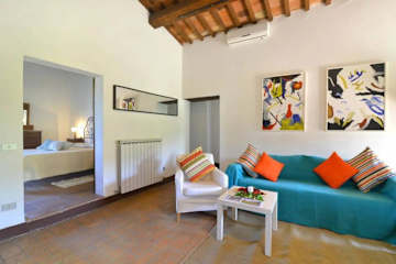 Turquoise sofa and white chair