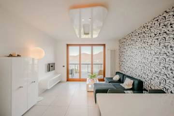 Living room with sofa and lake view