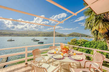 Table on a terrace overlooking a lake