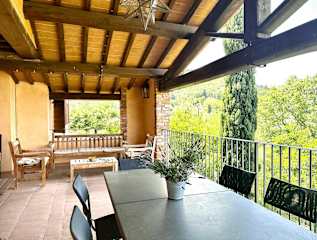 View from a window of a garden and terrace
