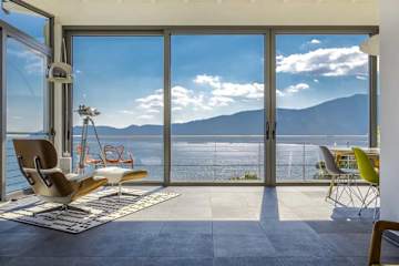 Plastic hanging seat with lake view in a living room