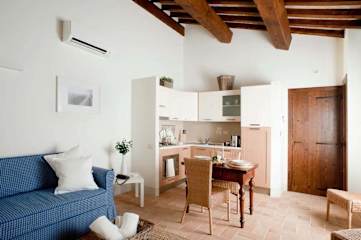 Modern kitchen with small wooden table