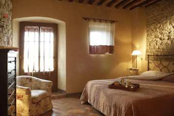 Bedroom with double bed and chair
