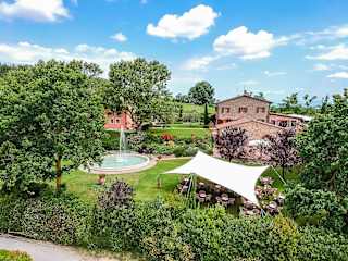 Circular pool in gardens in Tuscany