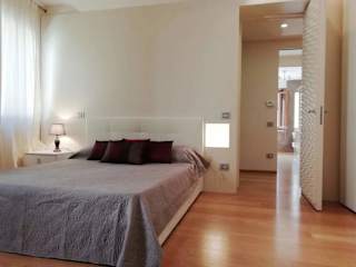 Double bed with grey blanket