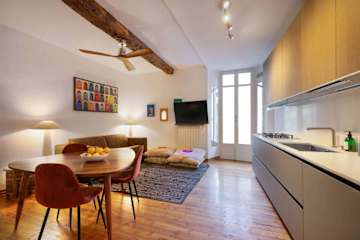 Kitchen and dining room with wooden table