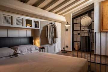 Four poster bed in dimly lit room