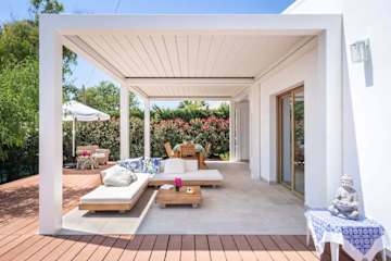 Open wardrobe and open patio door leading to garden