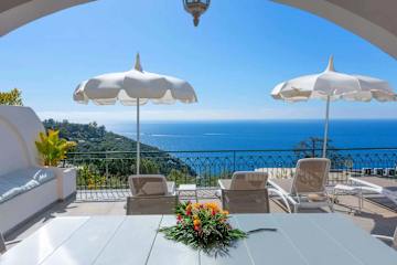 Sun beds on a terrace overlooking the sea