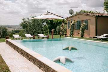 Loungers next to a pool