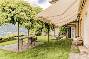 Outdoor table and chairs under vines
