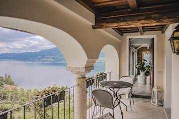 Chairs on a balcony with lake views