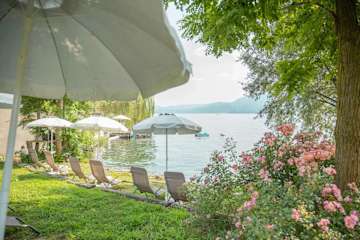 Sun loungers next to a lake