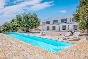 A pool in front of a house