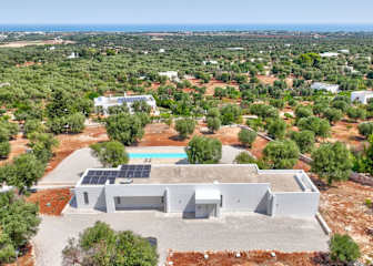 A pool in front of a house