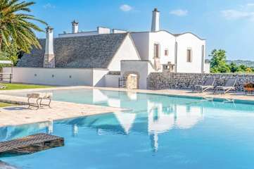 A swimming pool and white house