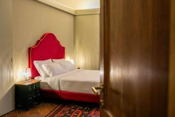 Bed with red headboard
