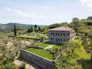 An old stone house with a walled garden