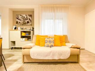 A sofa with yellow cushions